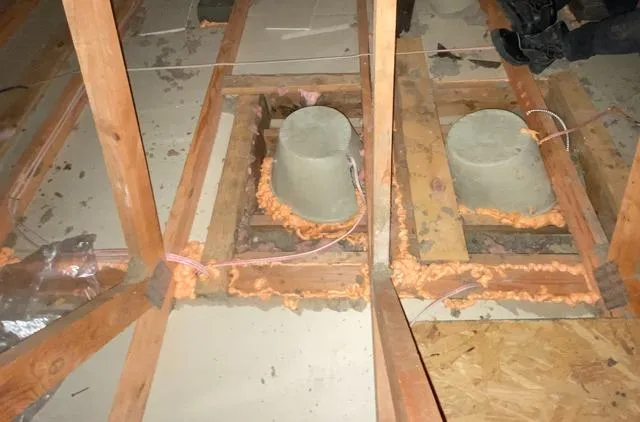 Spray foam air sealing around plumbing penetrations in attic floor