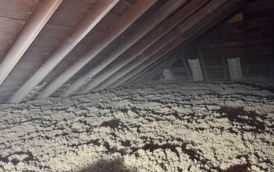 Attic insulation being installed in a Brooklyn home
