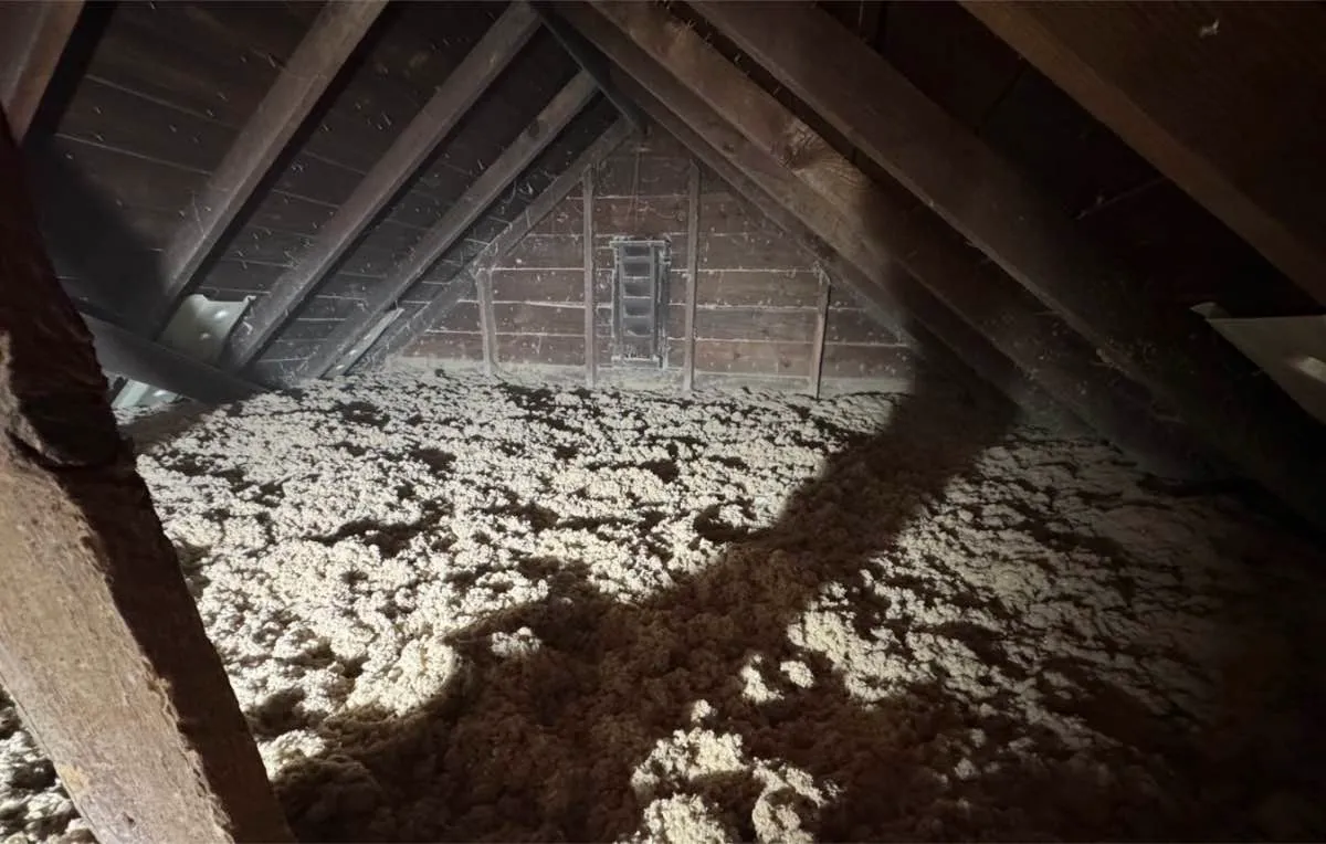 Completed attic insulation covering entire floor with even depth - NY Energy Project