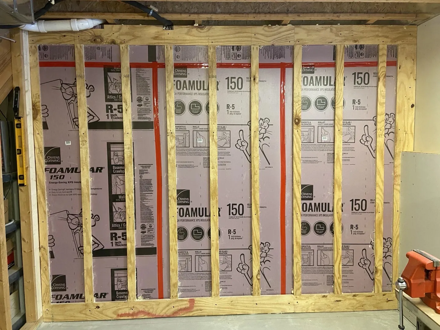 Foamular XPS R-5 rigid foam boards installed between studs on basement wall