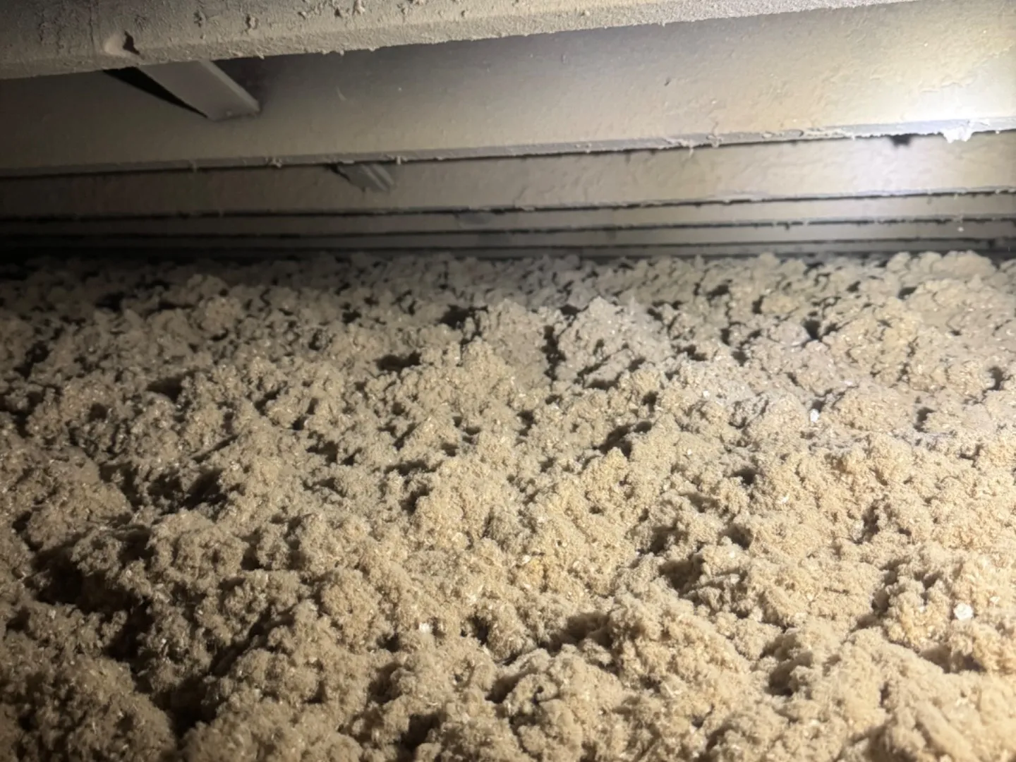 Completed blown-in insulation covering entire attic floor - NY Energy Project