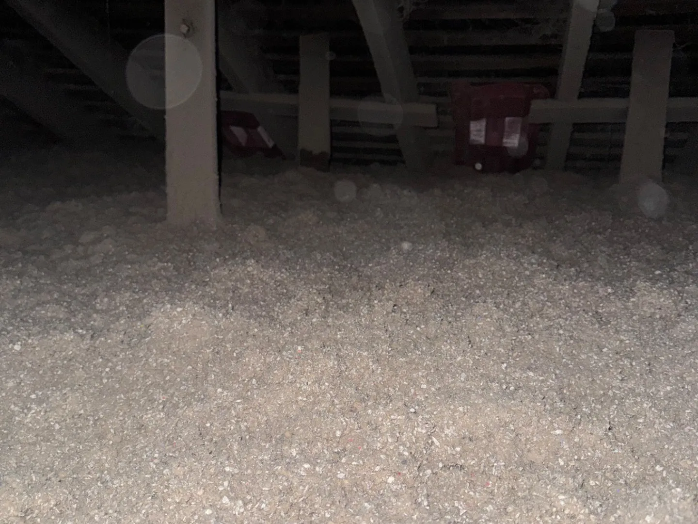 Blown-in cellulose insulation covering an attic floor - NY Energy Project job site