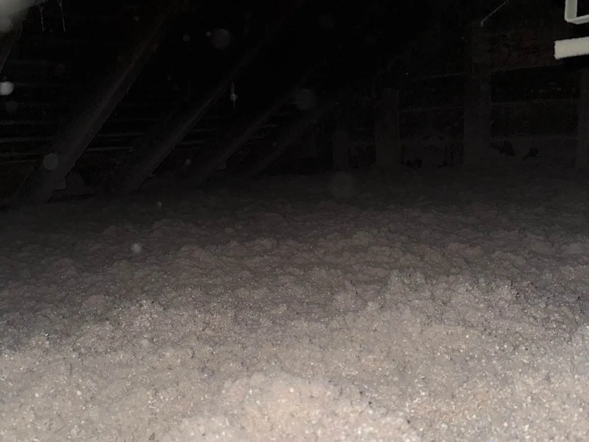 Completed cellulose insulation covering attic floor with even depth - NY Energy Project