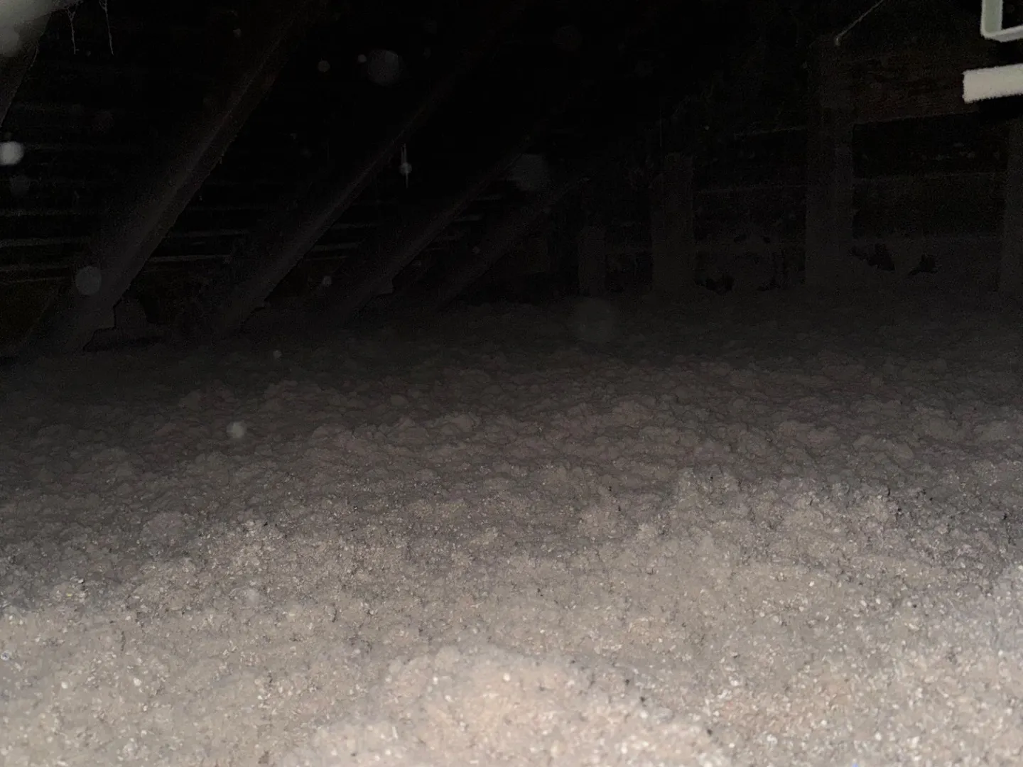 Completed cellulose insulation covering attic floor with even depth - NY Energy Project
