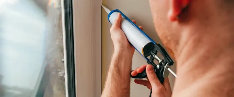 Illustration of a house showing air leaks being sealed in windows, doors, and attic to enhance energy efficiency.